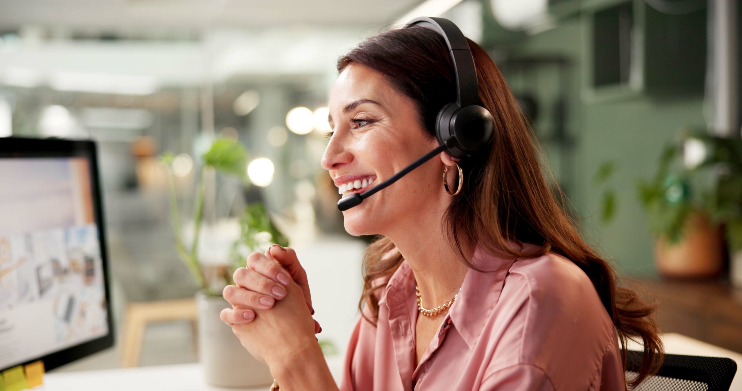 Girl, headset and computer screen at call center in office with crm, customer service and sales inf.